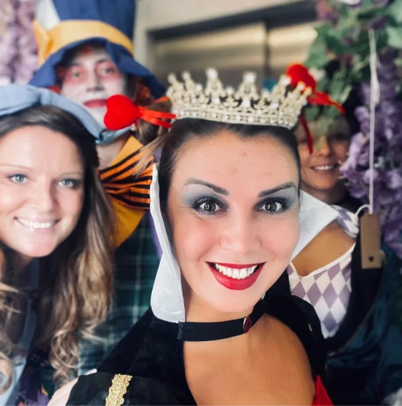 Three women dressed in costumes 